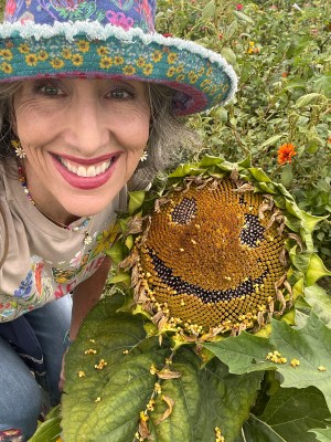 Michelle with a smiling sunflower